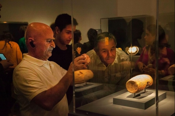 Guests view the Cyrus Cylinder in the new exhibition (Asian Art Museum San Francisco)