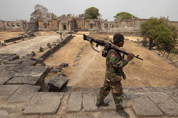 A Cambodian solider guards the grounds of the 11th-century Preah Vihear temple as tensions remain high on both sides of the border, on Feb. 8, 2011 in Preah Vihear, Cambodia. The 900-year-old temple belongs to Cambodia following a 1962 World Court ruling but this remains disputed by many Thais. (Paula Bronstein/Getty Images) 