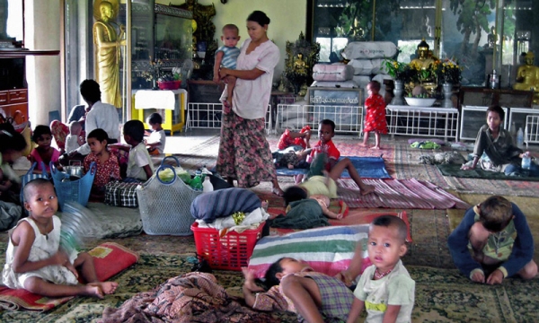 Displaced residents who lost their homes take shelter in a Buddhist temple in Yangon on May 5, 2008. (Hla Hla Htay/AFP/Getty Images)