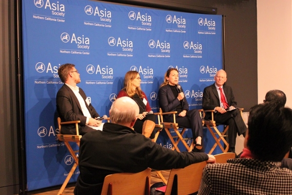 Dana Hyde (holding the mic), CEO of Millennium Challenge Corporation, started off the event. (Asia Society)