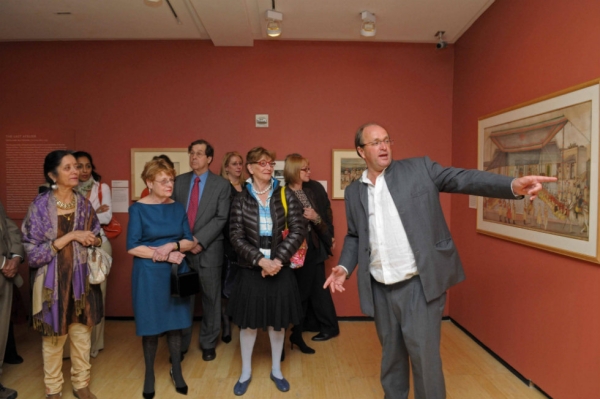 Historian William Dalrymple (R), co-curator of the exhibition, leads a tour for attendees. (Elsa Ruiz)