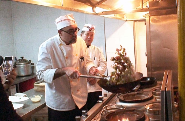Howie Southworth cooks up jambalaya for the staff at the Lao Shanghao restaurant in Harbin, Heilongjiang, China. (Howie Southworth)
