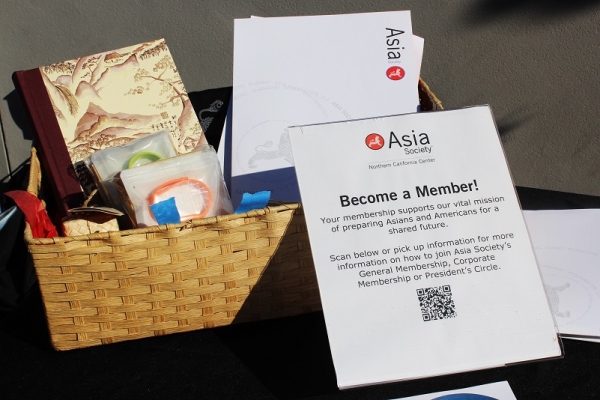 Gift baskets with prizes, including two President's Circle Memberships, await winners of the Open House Trivia (Stesha Marcon Asia Society).
