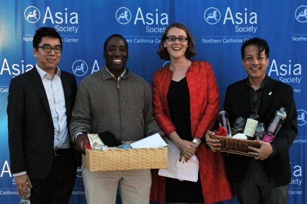 Rob Hsu, Asia Society (far left) and Eve Cary, Asia Society (center right), pose with Trivia winners (Stesha Marcon Asia Society).