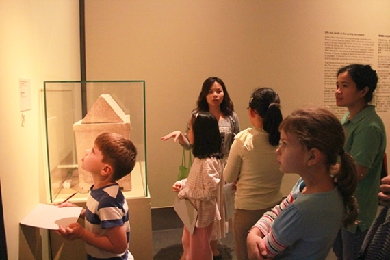In the second chamber, the children listened intently as Ms. Sally Yeung discussed the use of an ossuary in the Jewish community.
