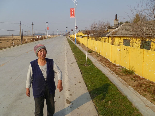 One of the villagers in Wasteland, China who has adjusted to the town's modernization with mixed feelings. (Michael Meyer)