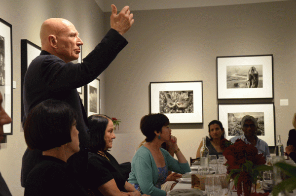 Sebastiao Salgado gestures while answering questions at a June 4 ASSC dinner at the Peter Fetterman Gallery.
