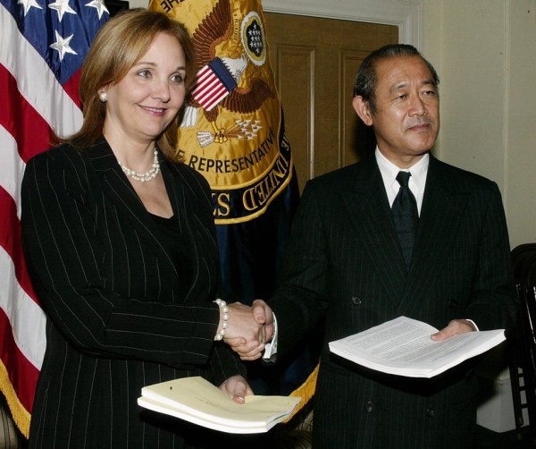 U.S. Deputy Trade Representative Josette Sheeran (L) shakes hands with Japanese Deputy Foreign Minister Ichiro Fujisaki on October 14, 2004 at the Trade Representative Building in Washington, D.C.(Stephen Jaffe/AFP/Getty Images)