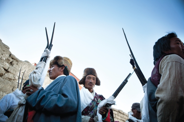 At the end of the Tiji festival, members of the king's court gather with their muskets to chase the demon from the city.  (Taylor Weidman)