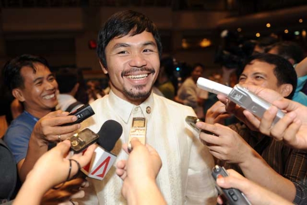 Philippine boxing hero and now congressman Manny Pacquiao speaks to members of the media during an orientation seminar at the House of Representatives in Manila on July 8, 2010. (Ted Aljibe/AFP/Getty Images)