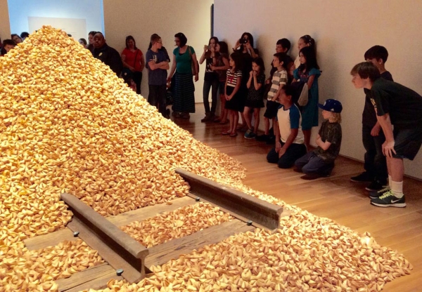 Students taking a close look at Hung Liu's "Old Gold Mountain" featured in the exhibition 'The Other Side: Chinese and Mexican Immigration to America.' (Sarah Hua)