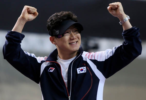 GOLD: South Korea's Jin Jongoh celebrates victory in the 10m air pistol men's final on July 28, 2012. (Marwan Naamani/AFP/GettyImages)