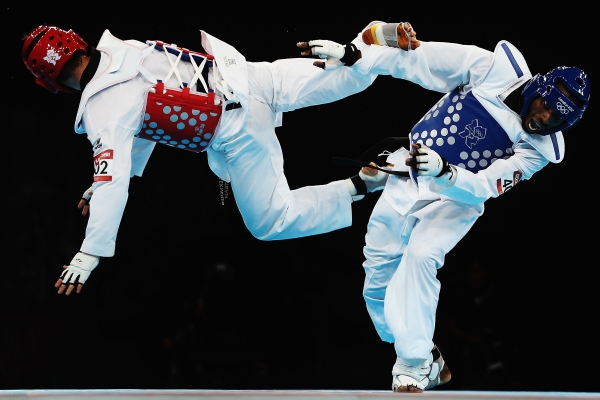 Mohammad Bagheri Motamed of Iran (L) competes against Diogo Silva of Brazil (R) during the Men's -68kg Taekwondo semifinal match on August 9, 2012. (Hannah Johnston/Getty Images)