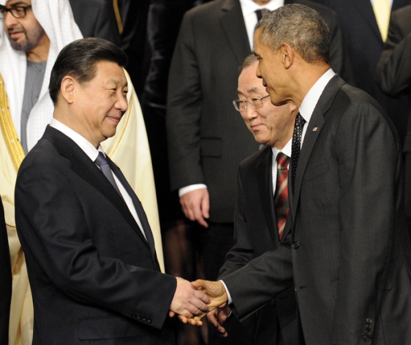 U.S. President Barack Obama (R) shakes hands with China's President Xi Jinping next to U.N. Secretary General Ban Ki-moon before the group photo at the 2014 Nuclear Security Summit on March 25, 2014 in The Hague, Netherlands. Leaders from around the world have come to discuss matters related to international nuclear security, though the summit is overshadowed by recent events in Ukraine. (John Thys/Pool/Getty Images)