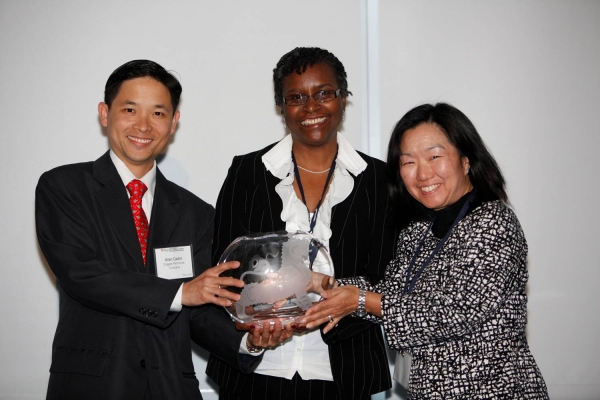 L to R: Allan Castro and Millicent Small-Williams of Colgate-Palmolive Company receiving the Award for Best Company for Asian Pacific Americans to Develop Workforce Skills from Linda Akutagawa