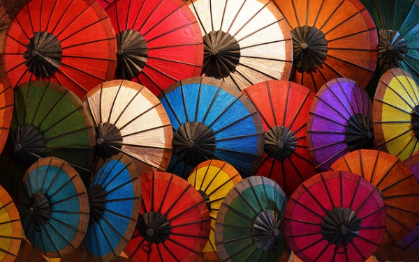 Traditional, colorful, oil-paper umbrellas clustered like flowers in Luang Prabang, Laos on May 10, 2014. (Attila Terbócs/ Flickr)