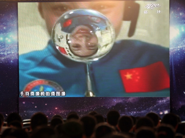 Chinese astronaut Wang Yiping becomes China's first space teacher as she broadcasts a live lesson to 300 students in a Beijing school from more than 300 kilometers above Earth's surface on June 20, 2013. (STR/AFP/Getty Images)