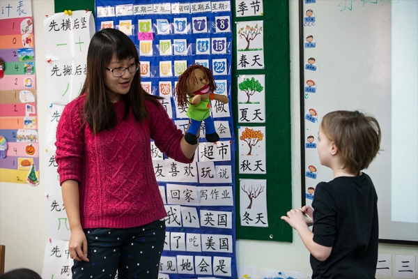 Using puppets and other props helps teachers create a classroom atmosphere where learning Chinese is interactive and engaging.