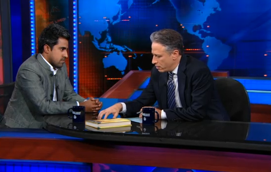 Anand Giridharadas with Jon Stewart on Jan. 24, 2011. (Comedy Central)