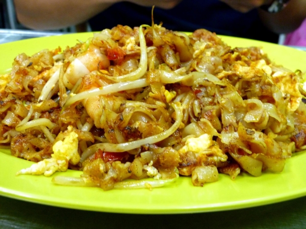 Char kway teow, stir-fried rice noodles with dark soy sauce with shrimp, egg, and sometimes cockles, from Singapore. (Saki Yuen)