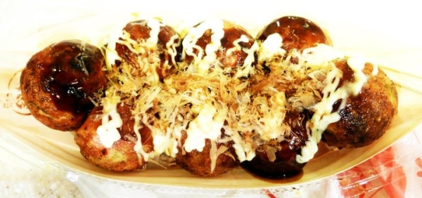 Takoyaki, "grilled octopus," are ball-shaped snacks commonly sold at festivals, or matsuri, in Japan, and have octopus, ham or even cheese stuffed in them. (Saki Yuen)