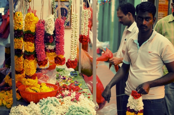A preoccupied garland florist in Singapore's vibrant "Little India" on July 9, 2012. (calvinistguy/Flickr)