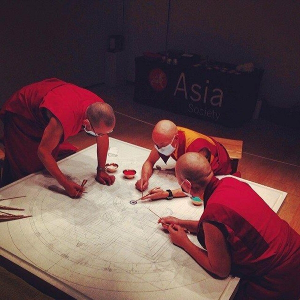 Monks from the Drigung (Drikung) Kagyu school of Tibetan Buddhism at work on the mandala at Asia Society New York. (Tahiat Mahboob)