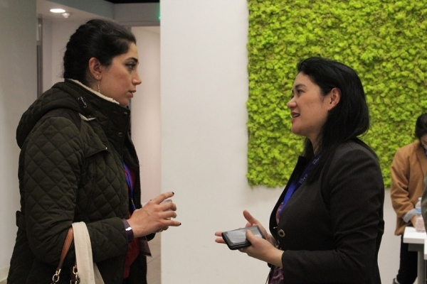 Lundberg (right) speaks to a participant after the panel discussion (Stesha Marcon).