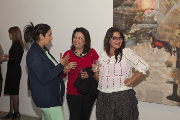 Artist Ranu Mukherjee (far right) chats with guests