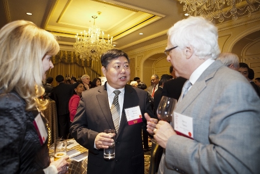 Honoree Dr. Minxuan Zhang (center) chats with Barry and Libby Taylor (Whitney Legge Photography)