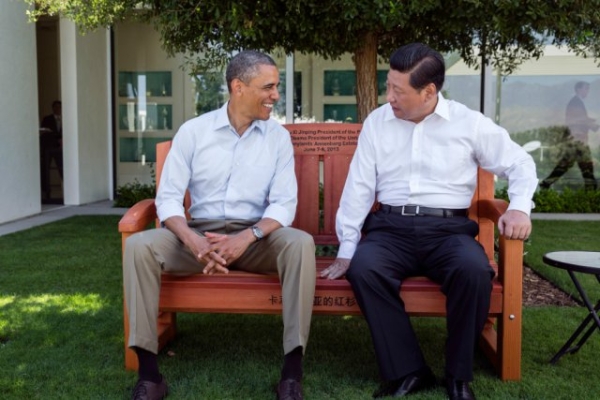 President Barack Obama presents President Xi Jinping of the People's Republic of China with a gift of an inscribed redwood park bench at the Annenberg Retreat at Sunnylands in Rancho Mirage, Calif., June 8, 2013. 