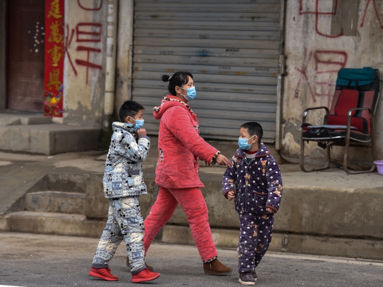 Residents of Wuhan, China wear protective masks to guard against the coronavirus.