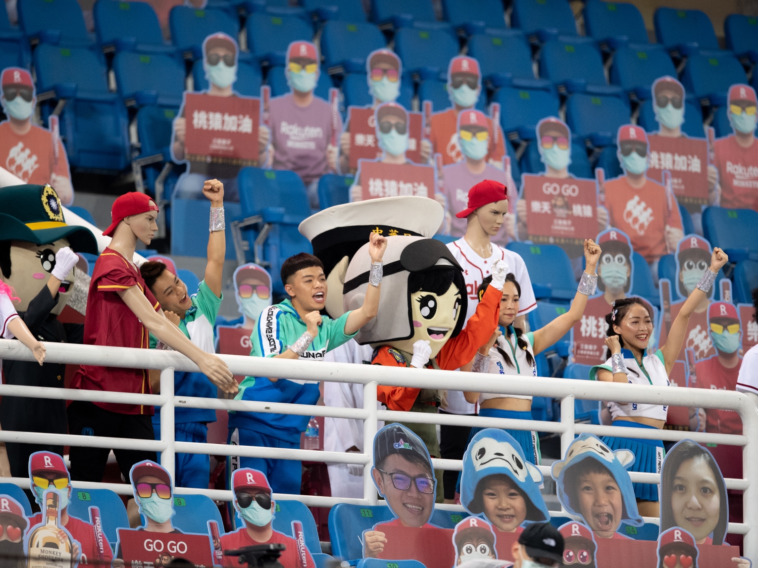 Taiwanese baseball fans attend a game alongside cardboard cutouts during the first months of the COVID-19 pandemic