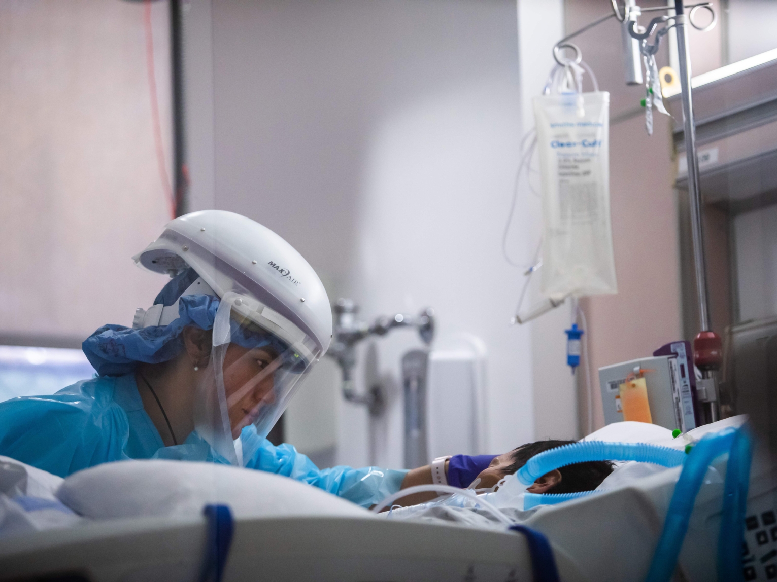 Registered nurse Yeni Sandoval wears personal protective equipment while she cares for a COVID-19 patient in the Intensive Care Unit at Providence Cedars-Sinai Tarzana Medical Center in Tarzana, California, on January 3, 2021.